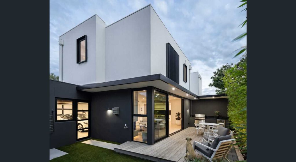 Custom aluminium window hood system above windows on a modern architectural building