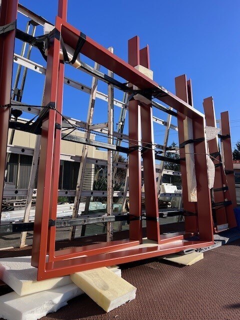 Installation of an aluminium window shroud around a modern architectural window