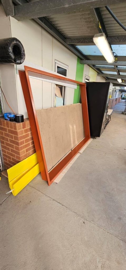 Custom aluminium window surrounds framing large windows on a modern Australian home