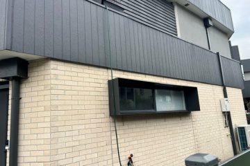 Custom aluminium window shrouds on a contemporary Australian cultural and performing arts building